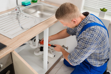 Fixing Sink Pipe With Adjustable Wrench