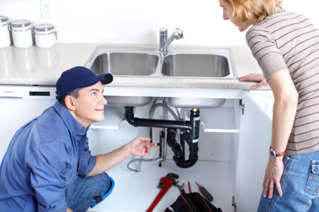 cheap plumber fixing a sink on call