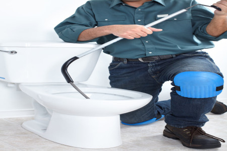 our best pro fixing a flush toilet