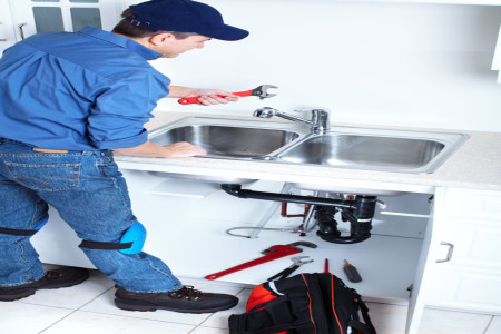 emergency plumber fixing sink