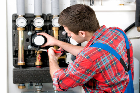 technician servicing the gas boiler